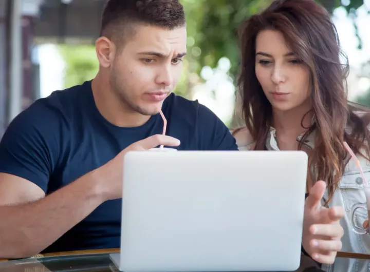 Confused parents look at computer